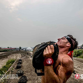 Shoulder press at the Spartan Wrecked obstacle using the Elite Force Gear Wrecker Training Sandbag